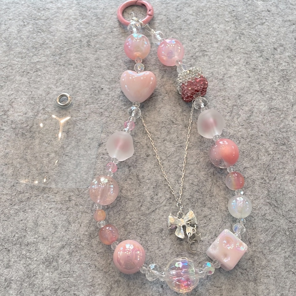 NEW- Pretty Pink Beaded Phone Wrist Charm
glossy, matte, and sparkling beads.